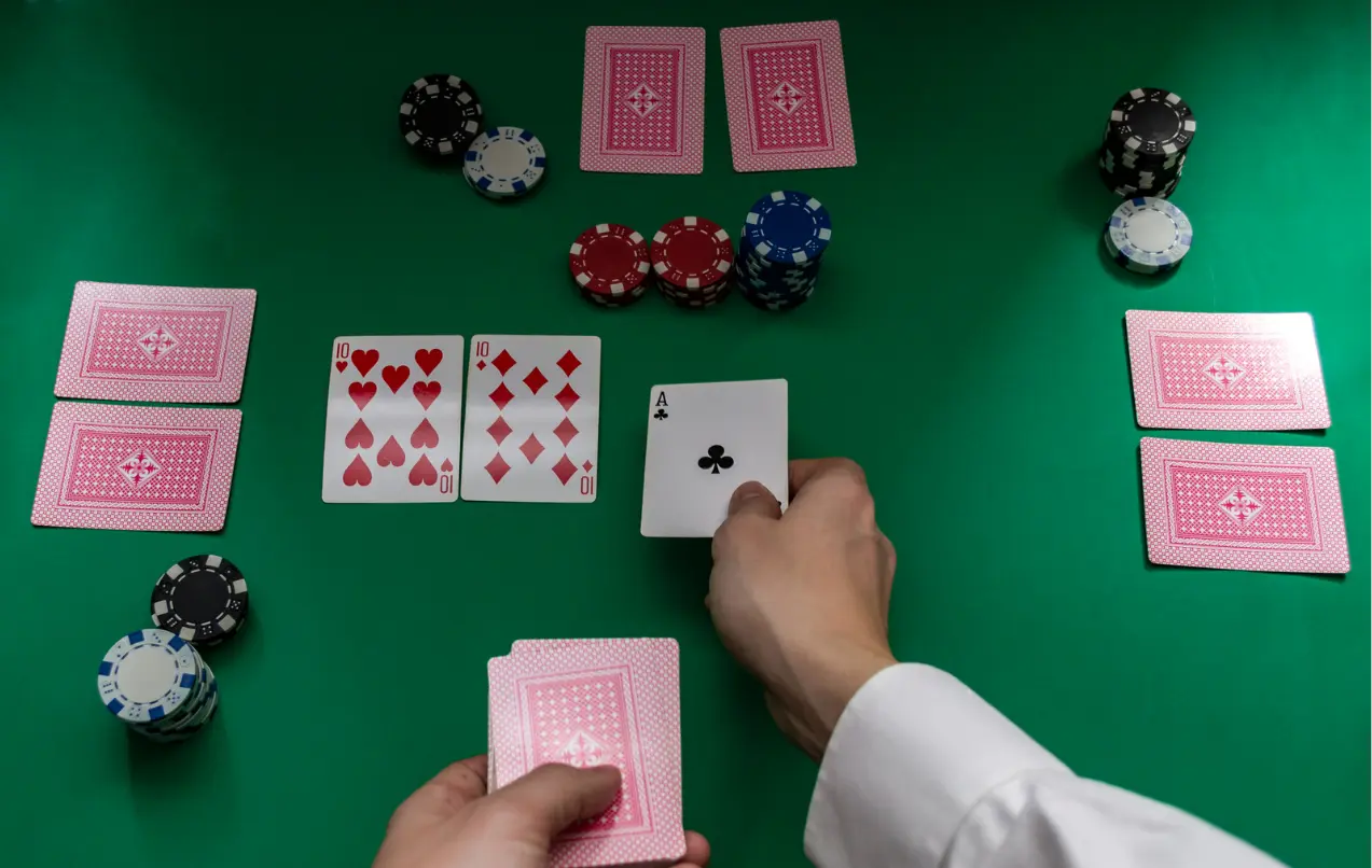 closeup-of-hands-of-poker-dealer-with-chips-in-casino-selective-stock